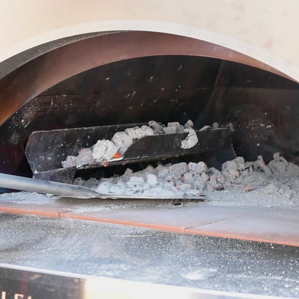 Close up of the internal part of an alfa oven after the wood burning flames have burned out.